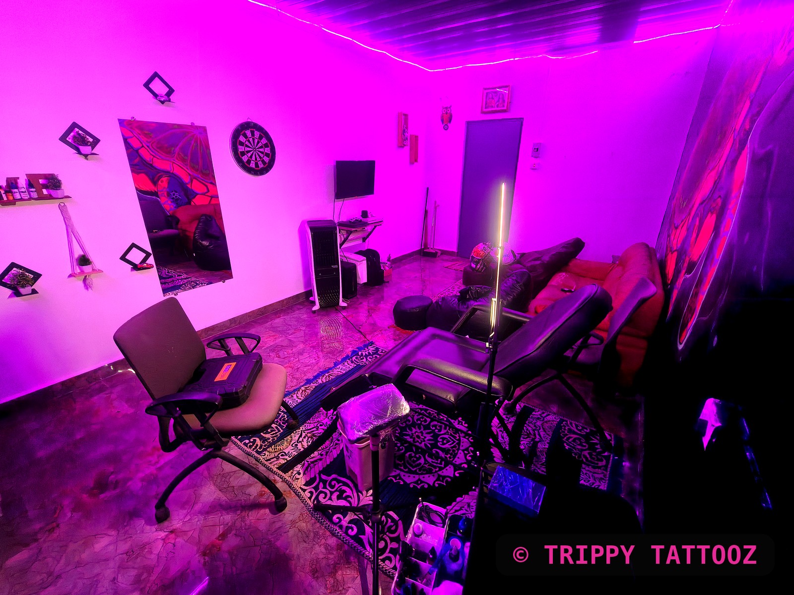 Trippy Tattooz studio interior with neon lighting